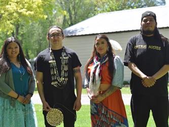 A photo of all of the members of the native american cultural committee outside.